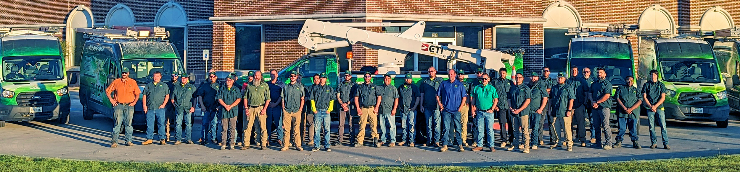 Tutor team and fleet in front of the office